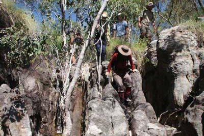 Climbing down into a small gorge near the top of Hill 420, photo R Willi