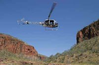 Helicopter landing in the Cockburn Range; photo P. Benjafield